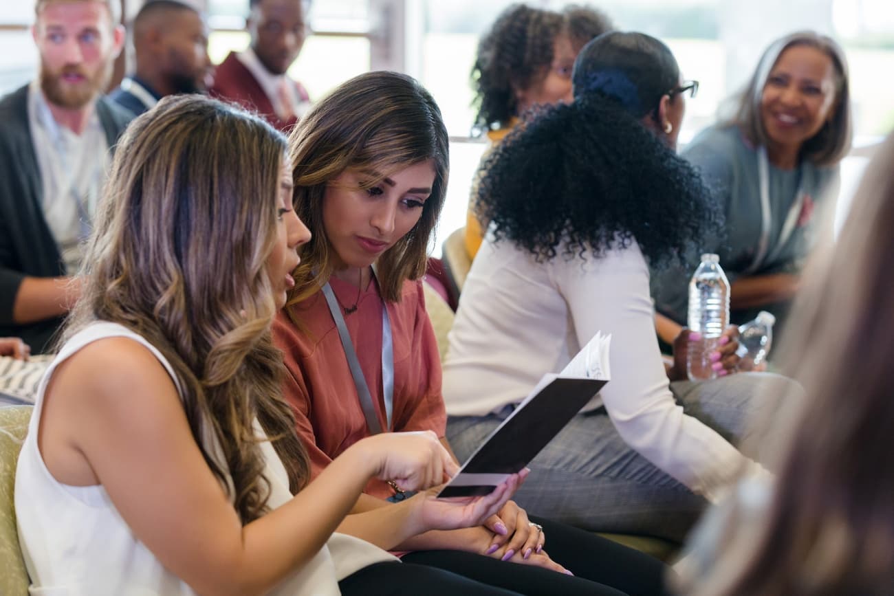 New AEs review the New AE Orientation Program of events