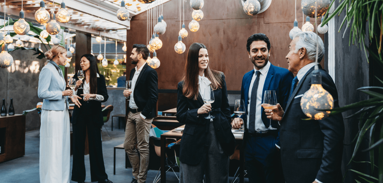 Business people are talking together during a teambuilding event in a luxury restaurant