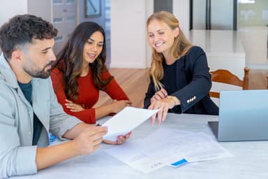 Agent and clients reviewing papers Agent and clients reviewing papers