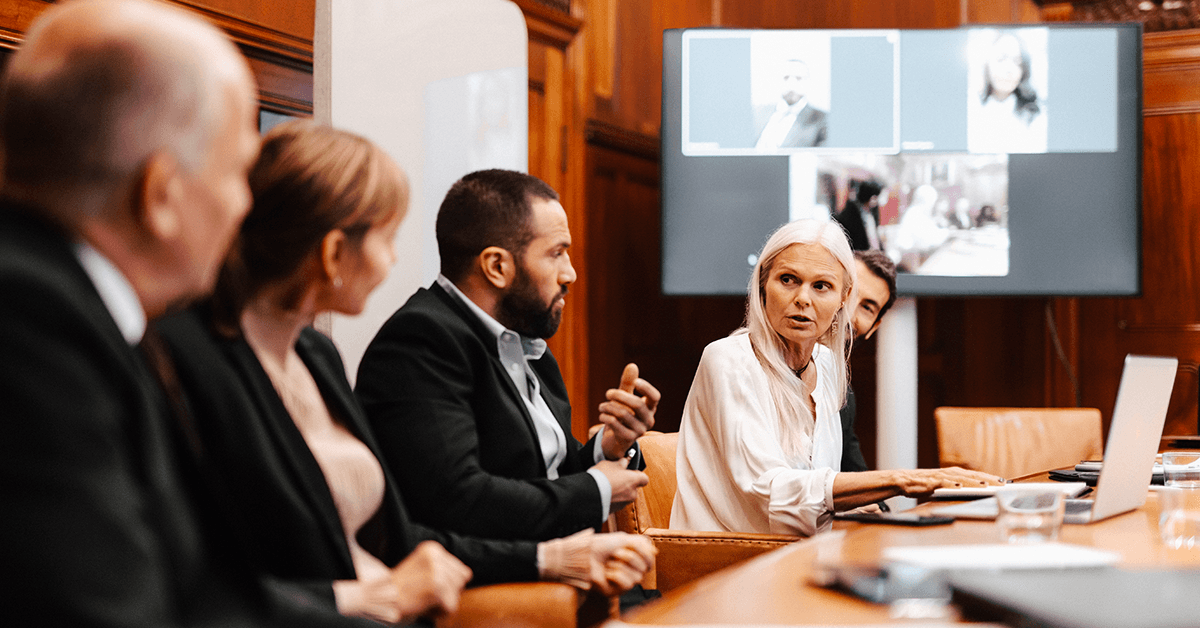 A Female Executive Talking with Colleagues in a Board Room Meeting Representing TREPAC Governmental Affairs Orientation in Round Rock, TX