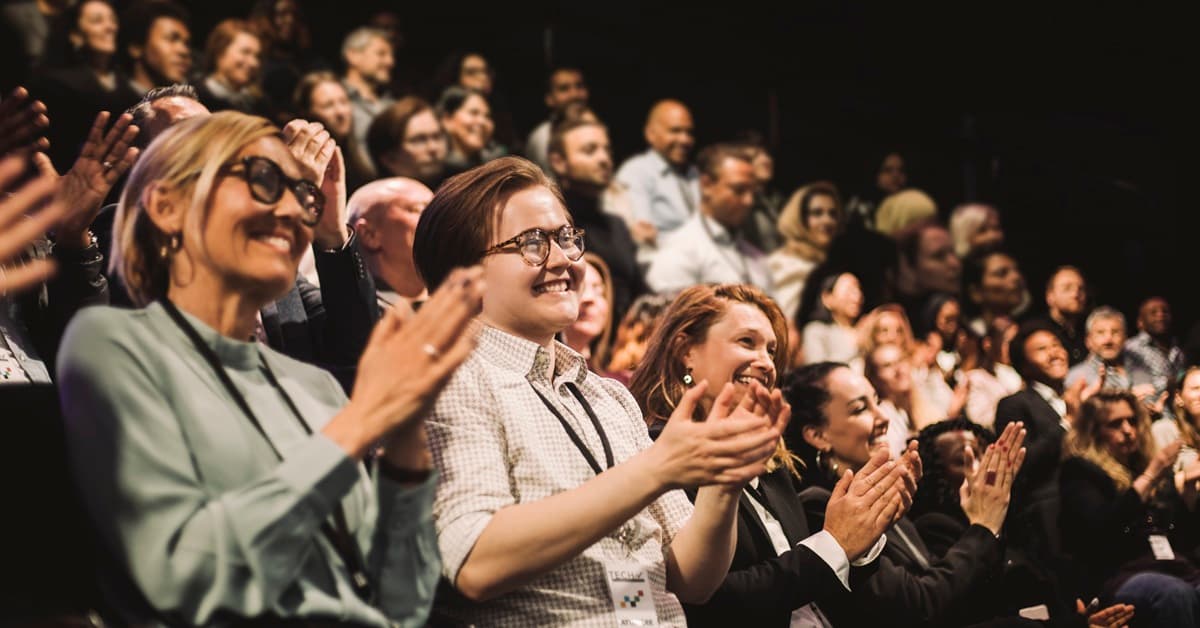 A Smiling Audience Claps During an Event Representing the Brunswick County Association of REALTORS® Broker Summit