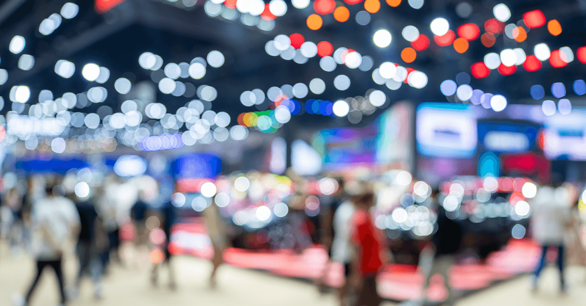 Blurry View of a Conference Exhibit Space Representing RLM Expo