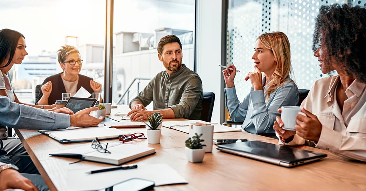 Brokers Talking Around a Conference Table