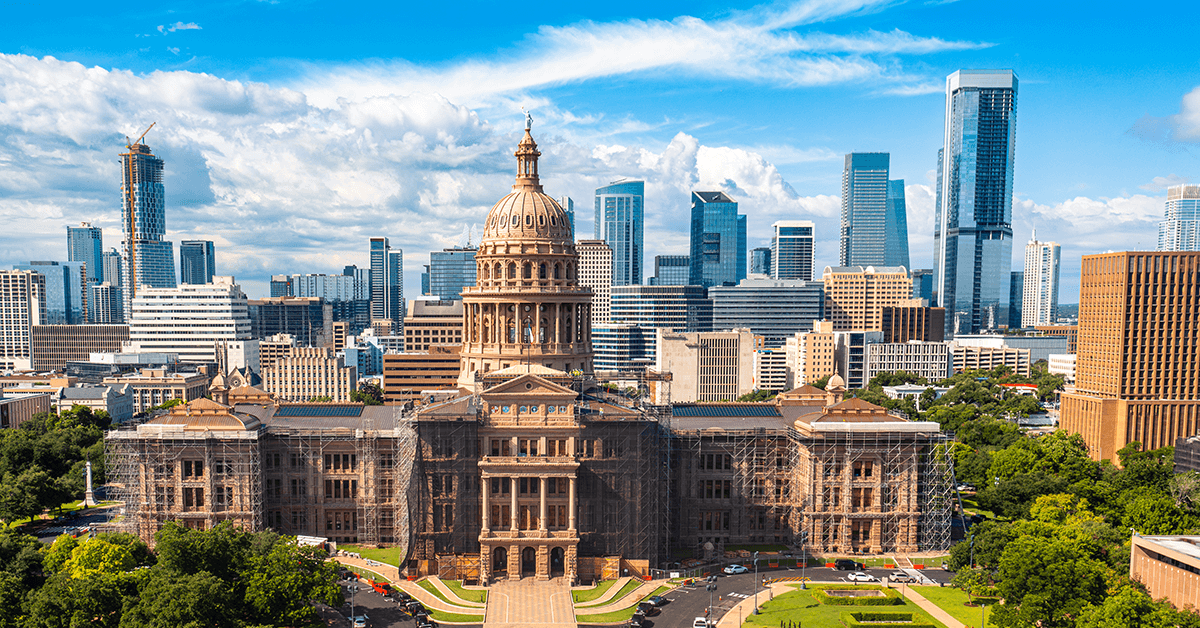 The State Capitol Building in Austin, TX with Skyline Representing the Texas REALTOR® Legislative Management Team