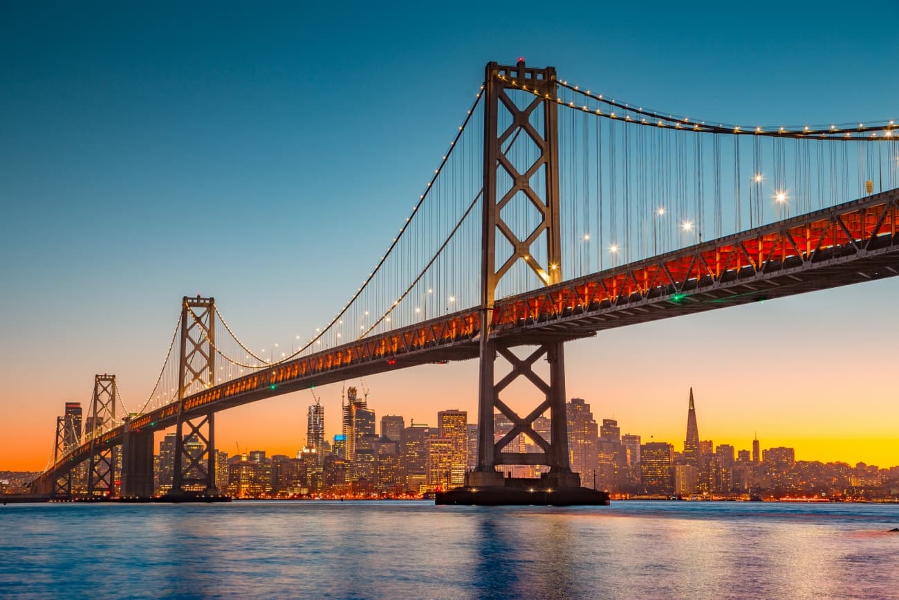 San Francisco skyline with Oakland Bay Bridge at sunset