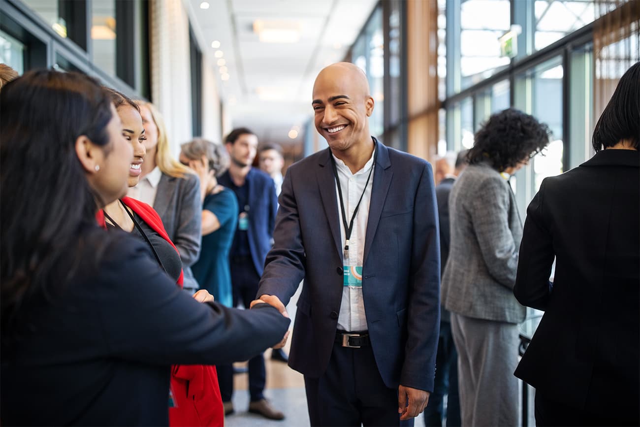 Conference attendees shaking hands Conference attendees shaking hands