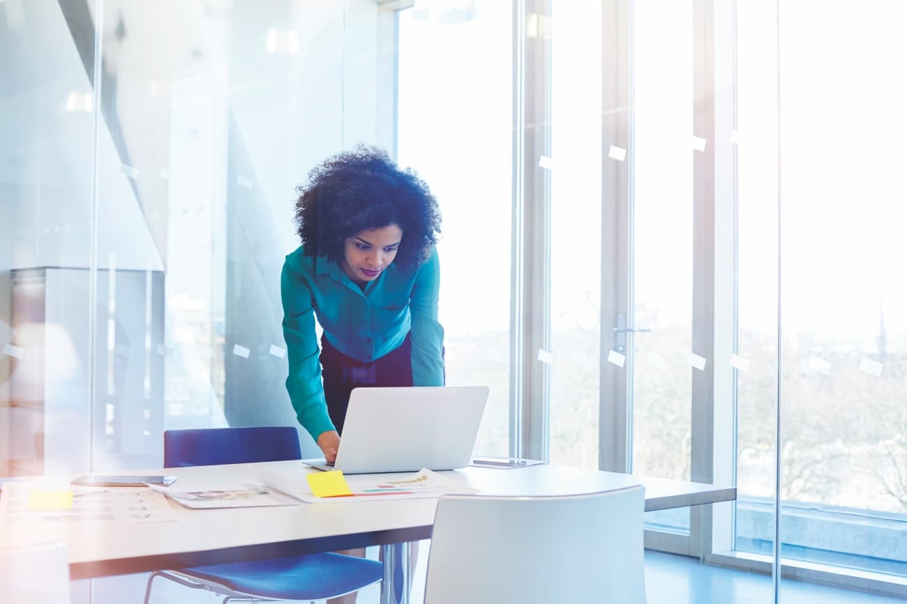 Business woman working in modern, glass office