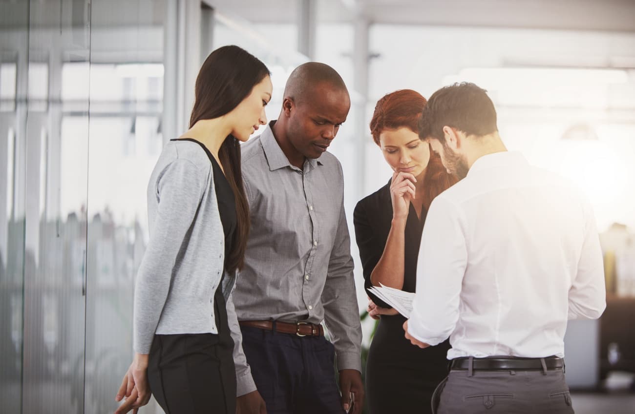 Business people discussing quarterly reports