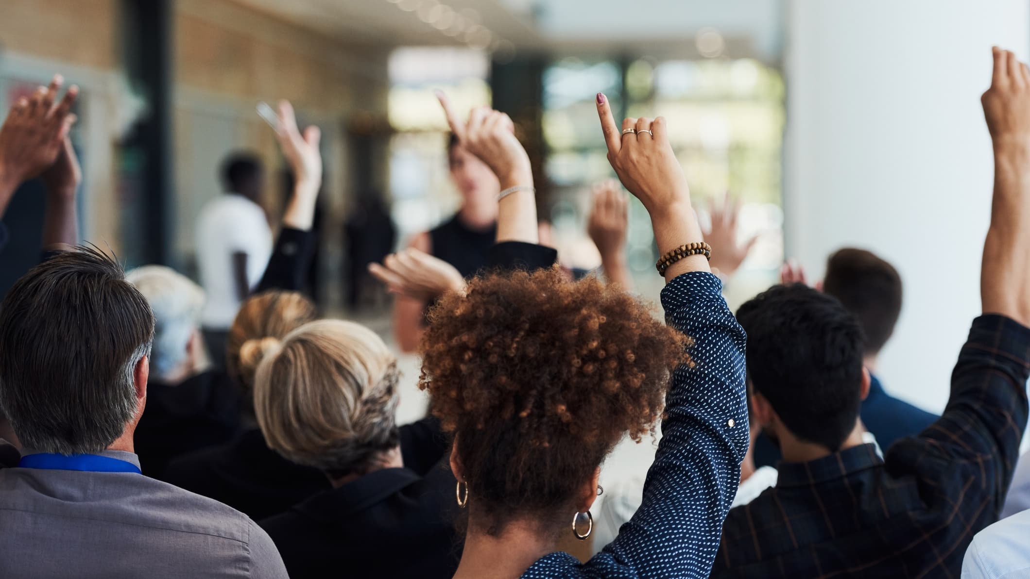 Business meeting hands raised RVP Regional Election Process