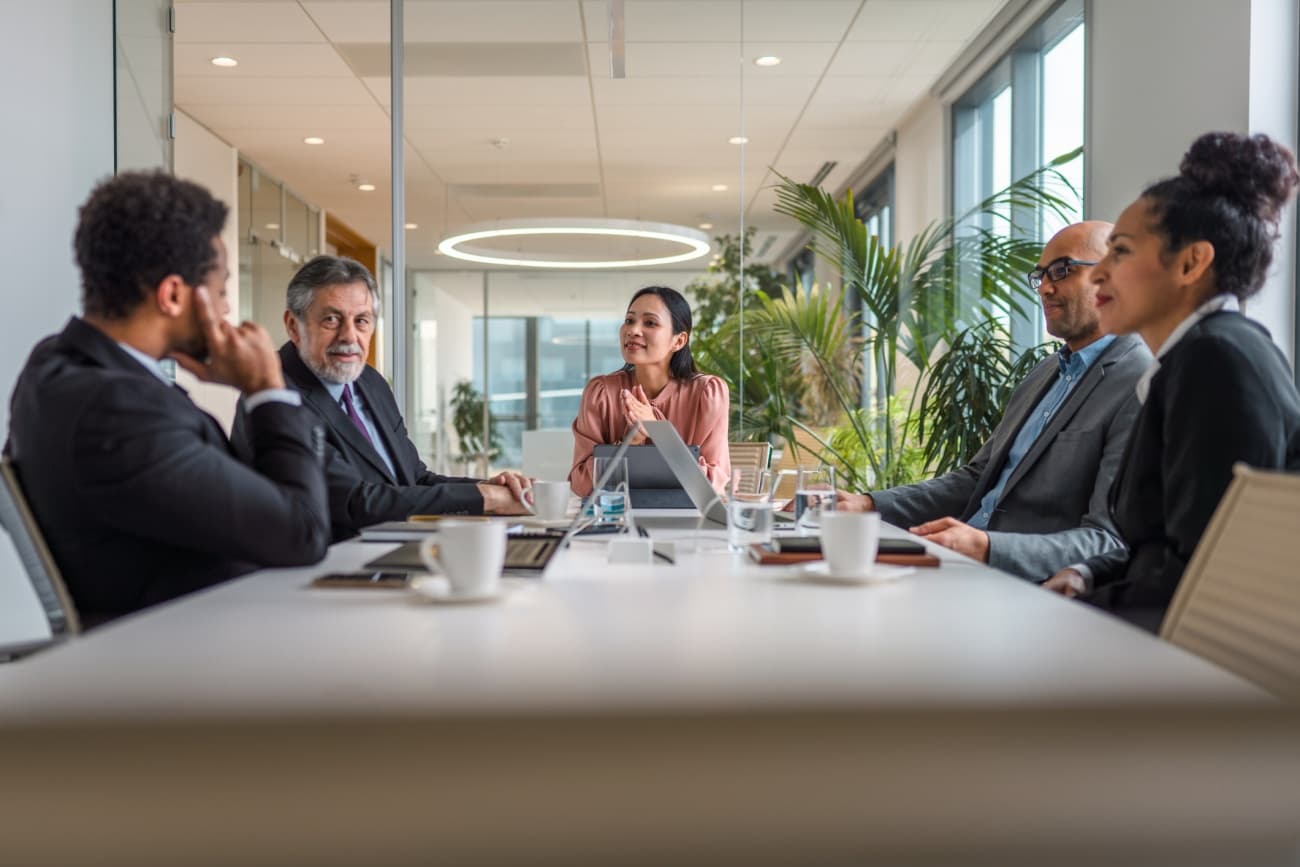 Multi-ethnic group of executives at conference table