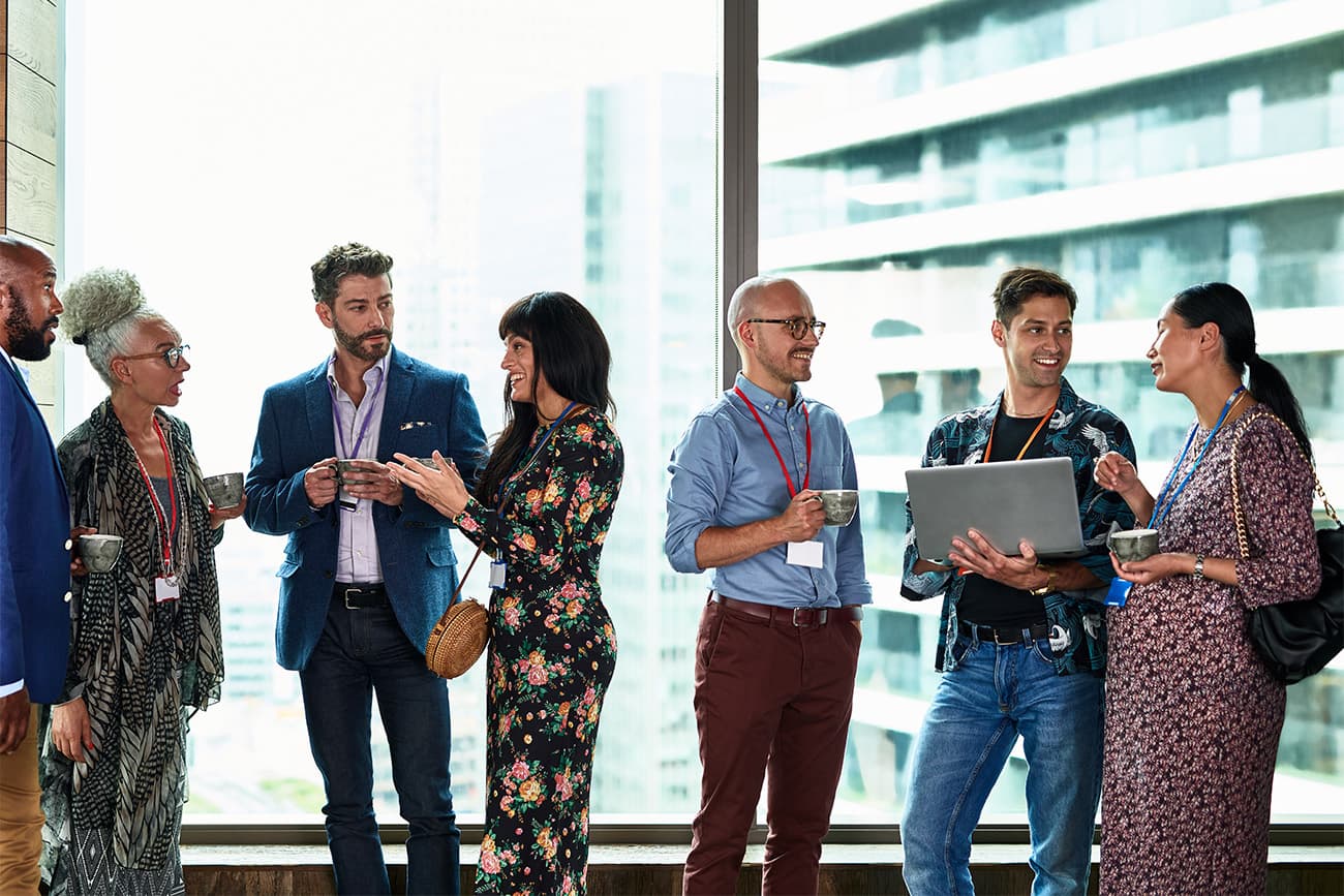 People chatting at a networking event People chatting at a networking event
