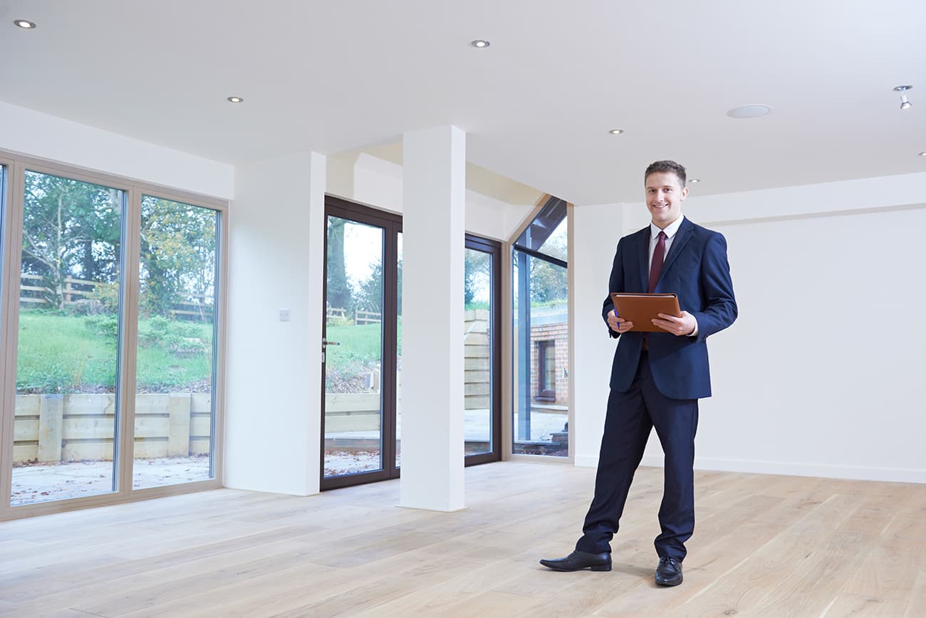 Real estate agent in empty home