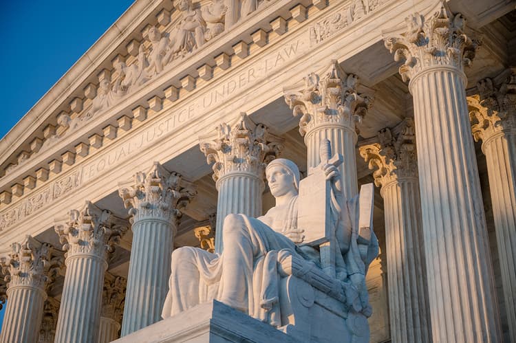 US Supreme Court statue and pillars US Supreme Court statue and pillars