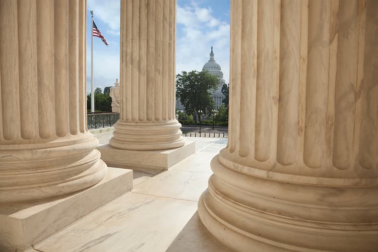 View of U.S. Capitol between columns View of U.S. Capitol between columns