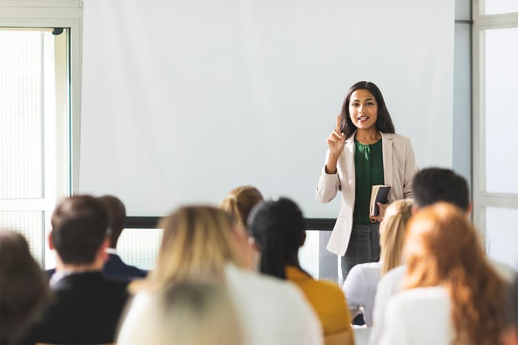 Woman teaching adults in a classroom Woman teaching adults in a classroom
