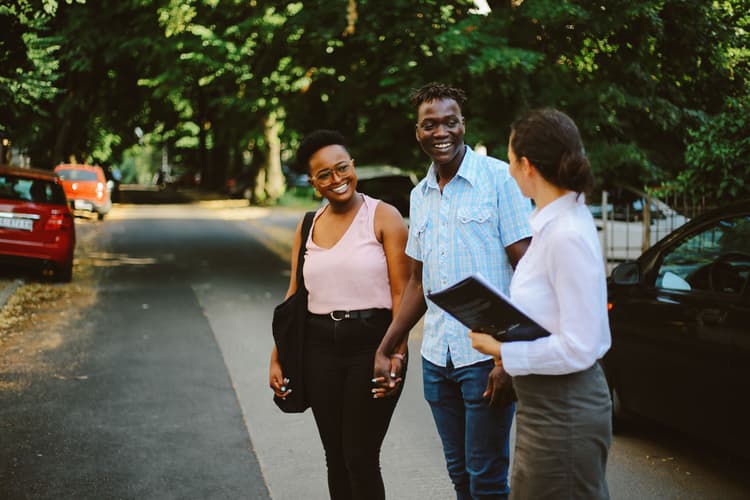 Young Black couple apartment shopping with agent Young Black couple apartment shopping with agent