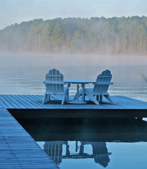 Adirondack Chairs and Table on Lake Dock