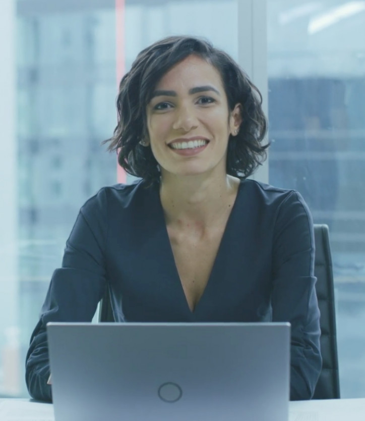 Business woman sitting at laptop in office 
