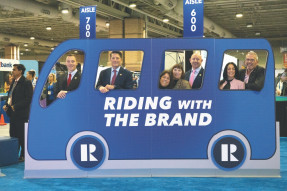 New Jersey REALTORS® pose for a Riding With The Brand photo op.