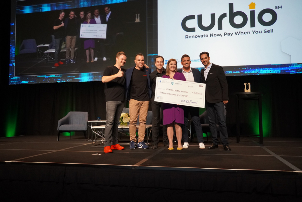 2019 iOi pitch battle winner Curbio team with big check