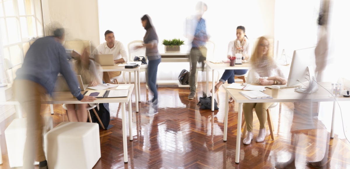 2203_DNG_busyoffice.jpg A busy open office with many workers