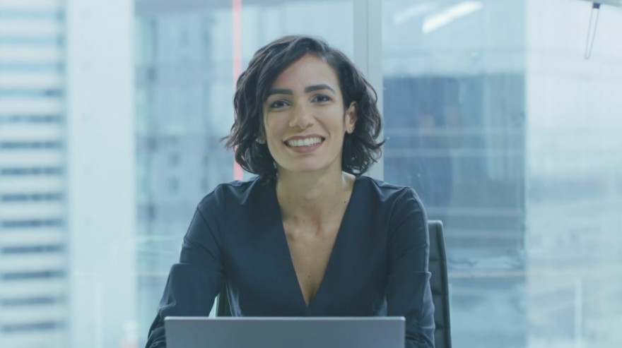 Business woman sitting at laptop in office 