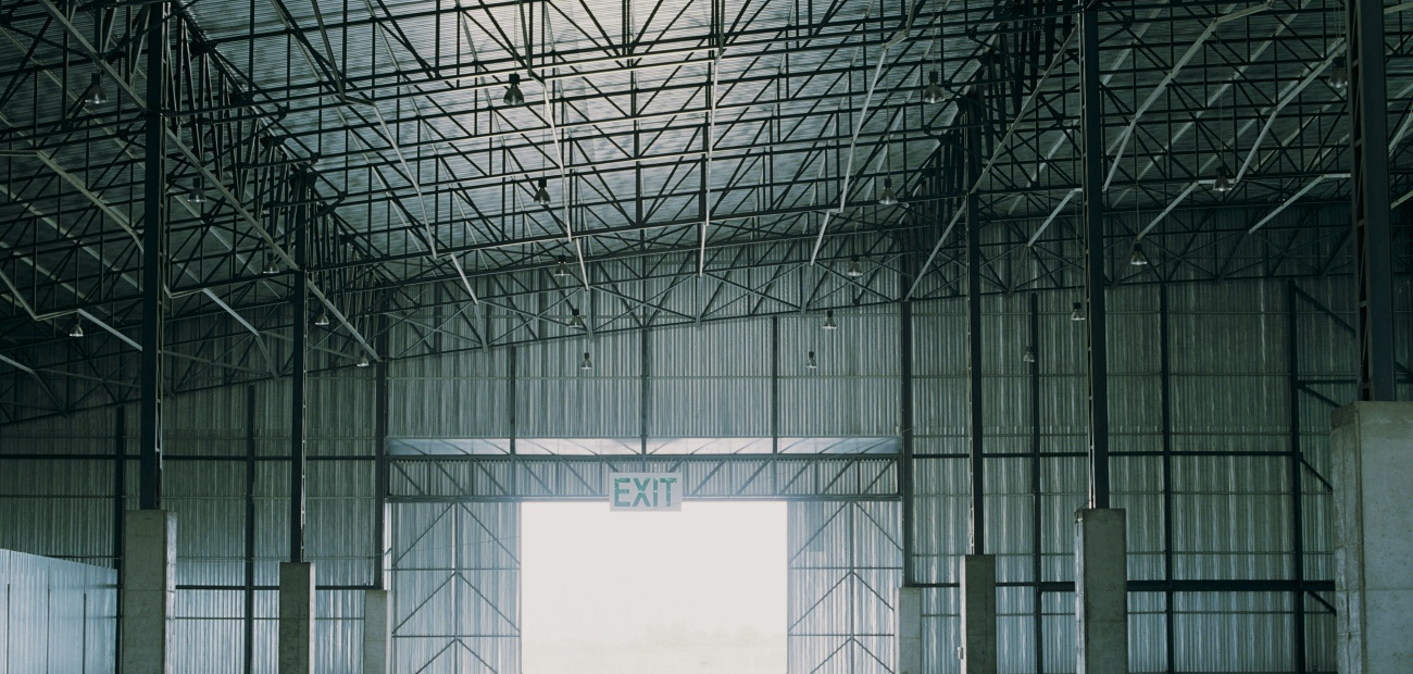 Empty warehouse, light shining through door