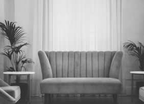Gray scale image of a couch in a living room
