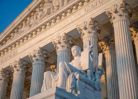 US Supreme Court statue and pillars