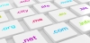 White computer keyboard with differently colored domain endings 3D illustration