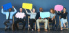 Group of people holding up speech bubbles