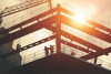 Construction site in silhouette with bright sunshine
