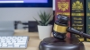 Close up of gavel and keyboard copyright infringement concept