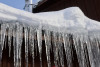 Ice hanging from building roof and gutters