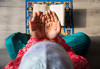Muslim man at home doing Salah, diversity, religious holidays