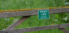 Private land sign attached to a wood gate