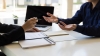 Two professionals discussing an internal investigation, risk management
