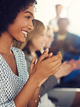 Group of diverse businesspeople clapping during a seminar