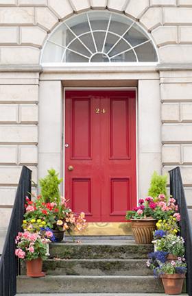 Red front door with flowers